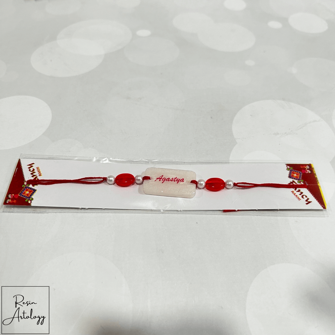 Resin Customised Name Rakhi for Rakshabandhan ( pearl White )