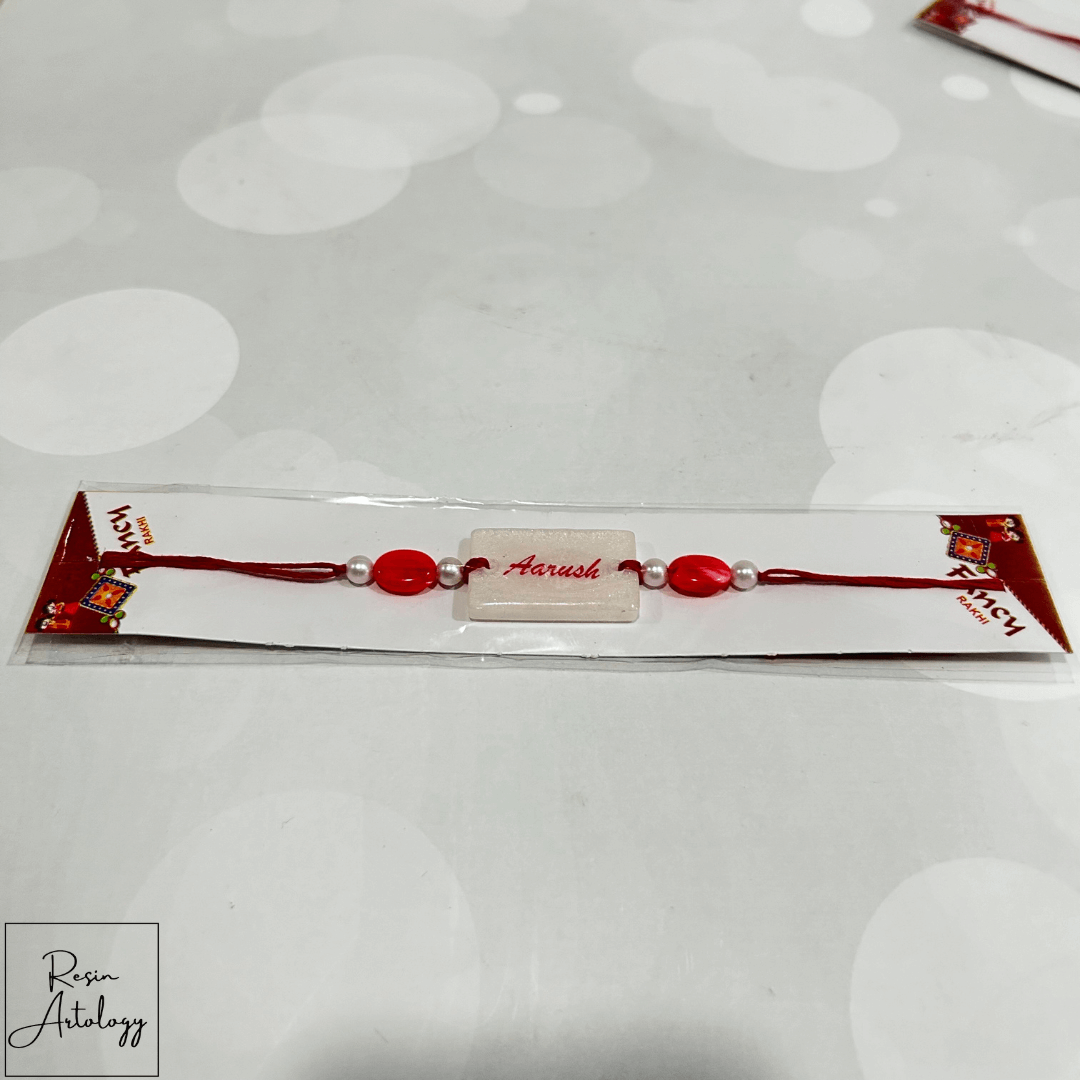 Resin Customised Name Rakhi for Rakshabandhan ( pearl White )
