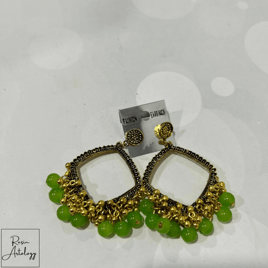 JHUMKA'S GREEN RA-2 earrings featuring a rich green hue and traditional Indian craftsmanship in a stylish design.