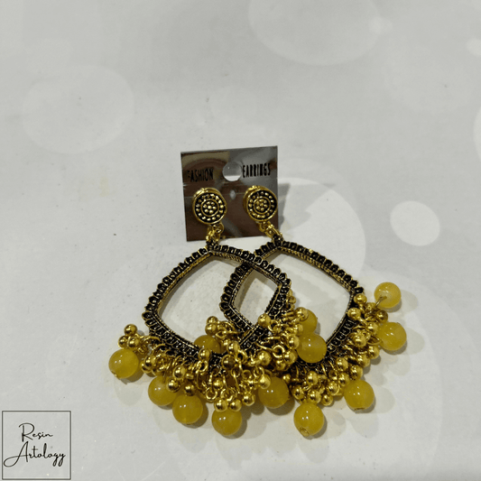 JHUMKA'S YELLOW RA-2 earrings featuring a vibrant yellow hue and traditional design with modern appeal.
