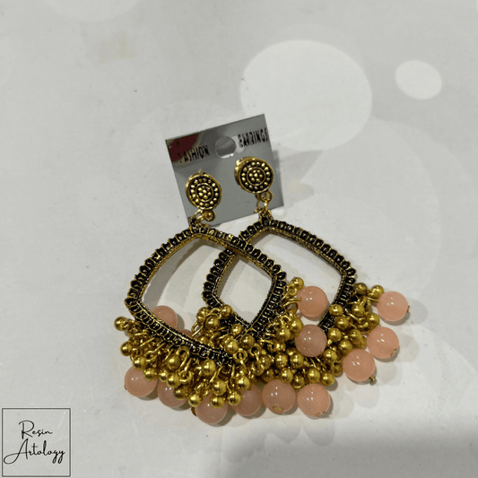 JHUMKA'S LIGHT PINK RA-2 earring featuring delicate light pink beads and intricate gold detailing.
