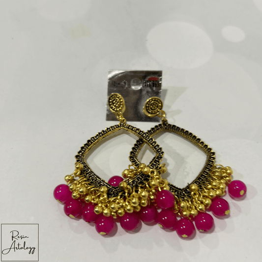 JHUMKA'S MAGENTA PINK RA-2 EARRING featuring vibrant magenta color and intricate design with gold accents.