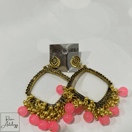 JHUMKA'S PINK RA-2 earrings featuring a vibrant pink hue and traditional design with gold accents.