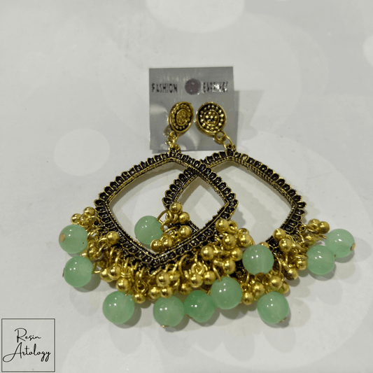 JHUMKA'S PISTA GREEN RA-2 EARRINGS featuring elegant gold detailing and pista green beads.