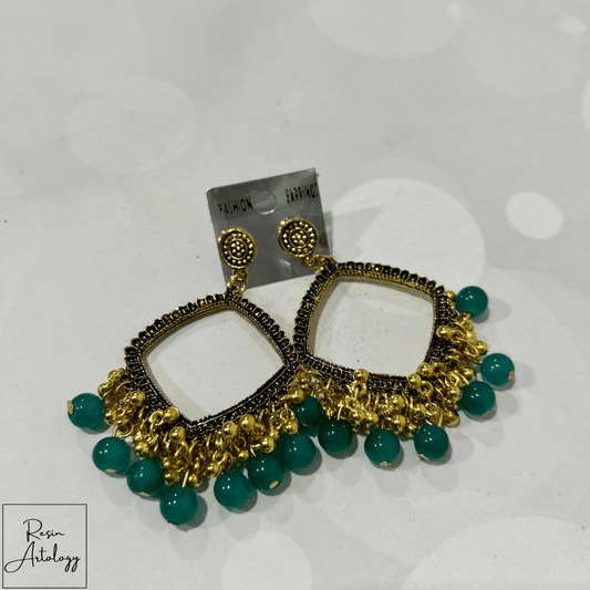 JHUMKA'S EMERALD GREEN RA-2 EARRINGS featuring a rich emerald green hue and traditional Indian design elements.