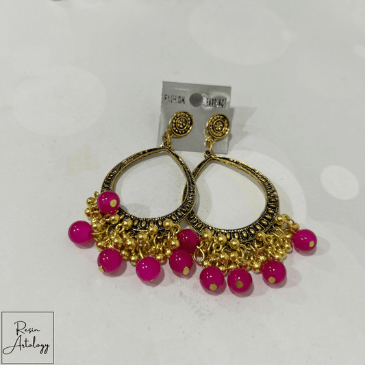 JHUMKA'S MAGENTA PINK RA-3 earrings showcasing vibrant magenta pink beads and intricate gold detailing.