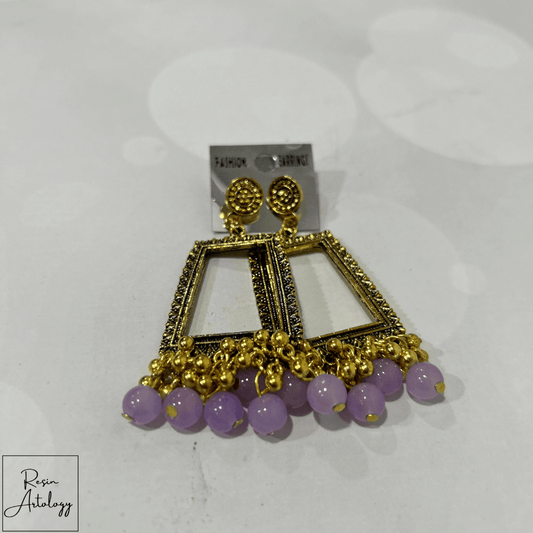 JHUMKA'S LAVENDER RA-4 earrings featuring a stunning lavender hue and intricate gold detailing.