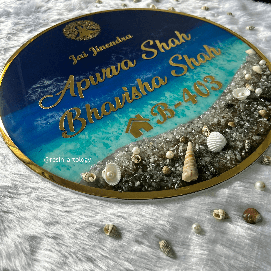 Resin Customized Name Plate featuring names Apurva Shah and Bhavisha Shah, embellished with seashells and a beach theme.