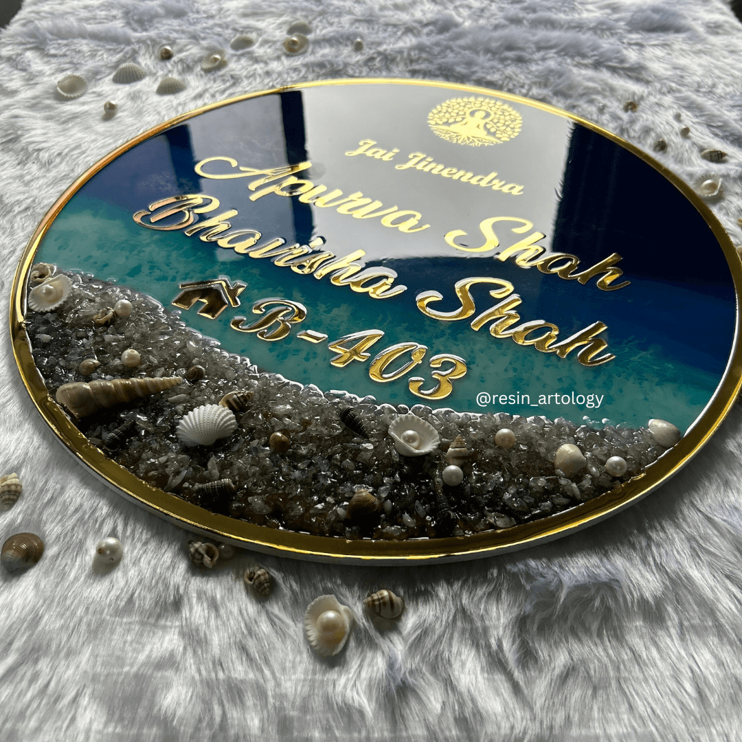 Resin Customized Name Plate featuring elegant design with names and intricate shell decorations.