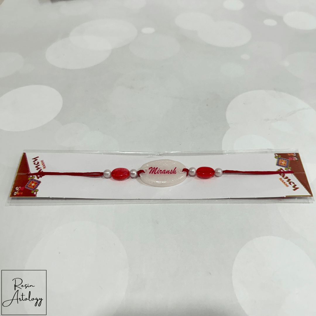 Resin Customised Name Rakhi for Rakshabandhan ( pearl White )